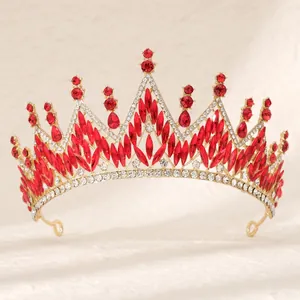 Baroque gold crown featuring red teardrop rhinestones and sparkling crystals