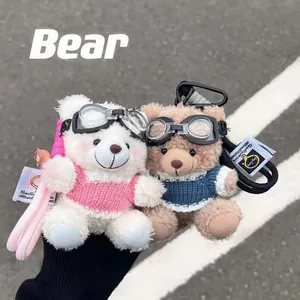 Plush pilot bear keychains with goggles and striped sweaters in white and brown