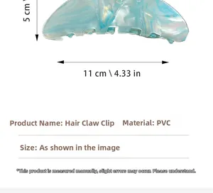 Detail of light blue acetate hair claw clip with 11cm marble texture and fish tail shape