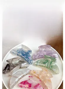 Detailed set of multi-color marble texture acetate hair claws in seven vibrant shades