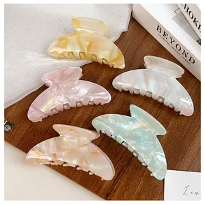 Detailed set of 5 large acetate hair claws with marble texture in soft pastel colors