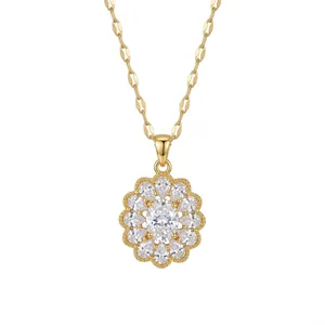 Gold floral pendant necklace with white oval zircon stones in an elegant vintage style