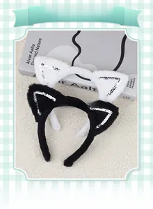 Close-up of cat ear headbands with soft faux fur and shimmering silver sequins detail