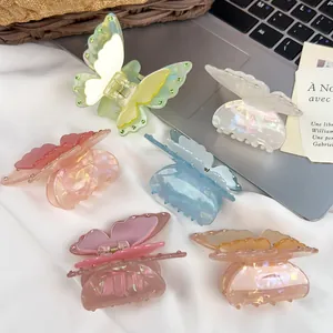 Exquisite set of six colorful acrylic butterfly hair claws with shimmering rhinestones