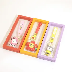 Detail view of cartoon keychains in colorful PE film floating display boxes