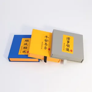 Macro detail of Chinese minimalist jewelry boxes with calligraphy gift tags and pull ribbons