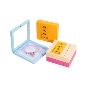Purple beaded bracelet in light blue PE film floating frame display gift box