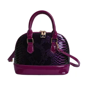 Purple faux snakeskin seashell bag with glossy patent leather and gold zipper detail