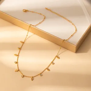 Minimalist gold necklace with hollow leaf charms and sparkling zircon accents on beads chain