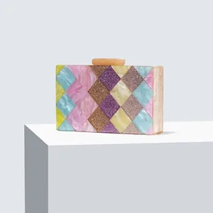 Macro shot of colorful acrylic geometric pattern and glitter panel detail on clutch