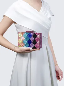 Detail of multi-color acrylic evening clutch bag with iridescent mosaic pearlescent finish