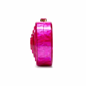 Detail view of pink marble acrylic evening bag with gold clasp and layered structure