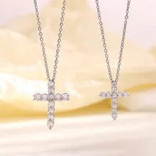 Detail of silver-tone cross pendants with inlaid zircons and double-layer O-chains
