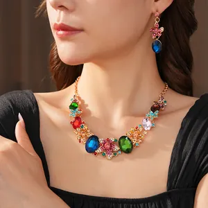 Vibrant crystal flower statement necklace and earrings set on a model for formal events