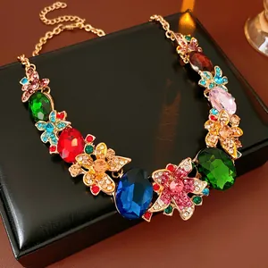 Macro shot of colorful gemstone floral necklace on premium black leather jewelry box