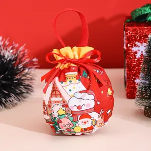 Close-up of red Christmas drawstring gift bag with Santa, snowman and bear character motifs
