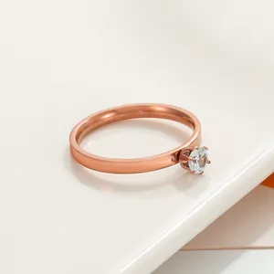 Macro detail of classic six-prong zircon setting on a rose gold plated crown ring