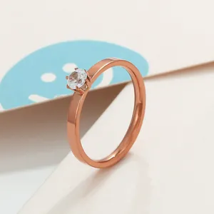 Detail of rose gold six-prong solitaire ring with brilliant round cubic zirconia stone