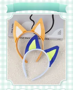 Close-up of soft plush puppy ear headbands in orange and blue for festive costumes