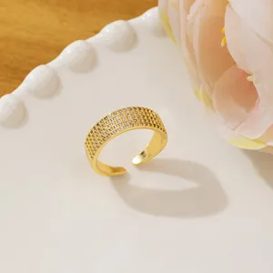 Adjustable gold pavé ring with four rows of sparkling cubic zirconia stones
