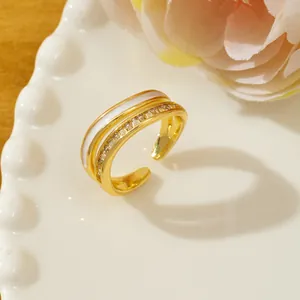 Detail of gold double-layer adjustable ring with micro-pave crystals and white inlay