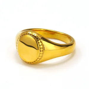 Vintage 18k gold plated signet ring with a round polished top and beaded edge detail