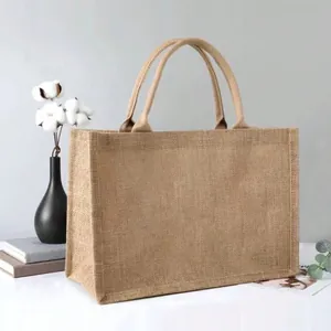 Detail of high-capacity jute tote bag featuring reinforced handles and natural woven texture
