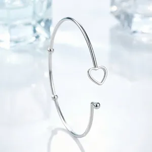 Minimalist silver stainless steel open bangle with hollow heart and bead design