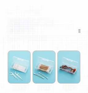 Macro shot of clear flip-top storage box showing dental floss and cotton swabs