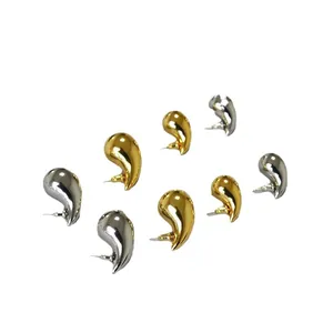 Set of minimalist gold and silver polished waterdrop earrings in a smooth metallic finish