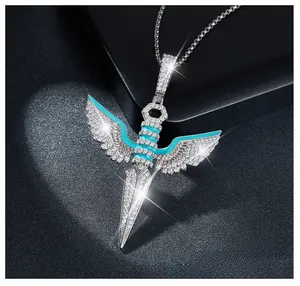 Macro shot of silver angel wing dagger pendant with blue enamel and sparkling stones