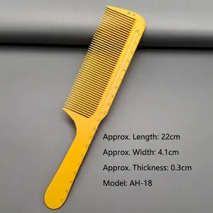 Detail view of yellow hair comb with scale markings showing 22cm length and AH-18 model
