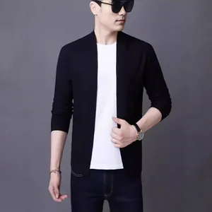 Classic black slim fit knit cardigan for men over white t-shirt and dark blue jeans