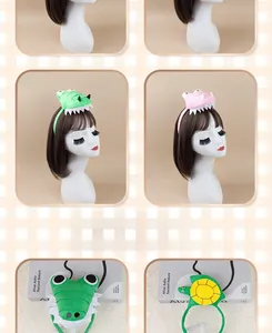 Detail of plush animal headbands featuring green crocodile and turtle shell patterns