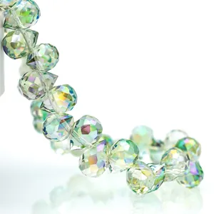Macro shot of faceted K9 teardrop crystal beads with AB aurora coating and iridescent glow