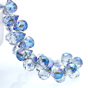 Macro shot of 4/6/8mm gradient blue and purple AB coated faceted teardrop crystal beads
