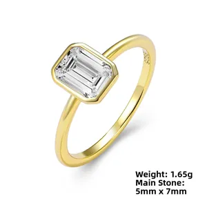 Detail of S925 sterling silver ring with rectangular emerald-cut zircon in gold plating