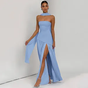 Detail of light blue strapless dress featuring high slit and elegant matching neck streamer