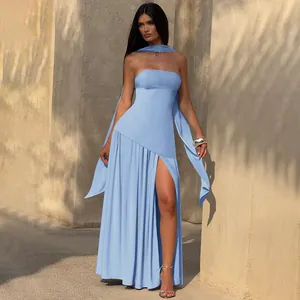 Detail of light blue strapless satin dress featuring a high side slit and long scarf
