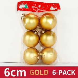 Set of six 6cm metallic gold Christmas ornaments in clear packaging with a festive card