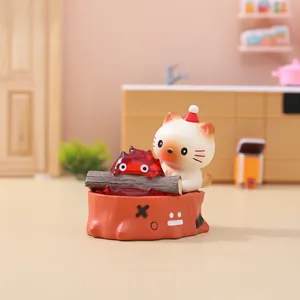 Detailed close-up of anime-style resin cat and fire spirit miniature night light ornament