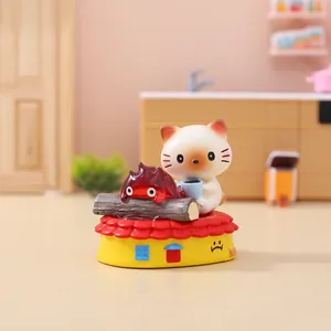 Macro view of miniature resin cat and translucent flame character on a decorative base