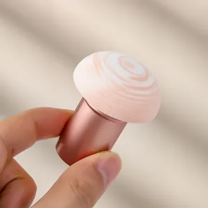 Mushroom head makeup sponge with rose gold handle for foundation and blending