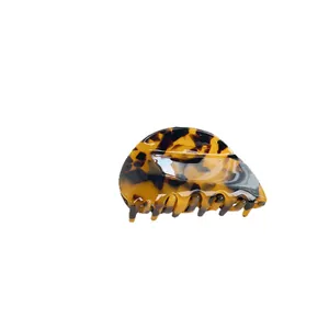 Classic tortoise shell acetate hair claw clip with minimalist semi-circle design