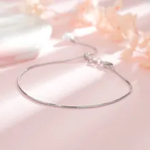 Detailed view of adjustable silver carrot rabbit bracelet with snake chain and clasp