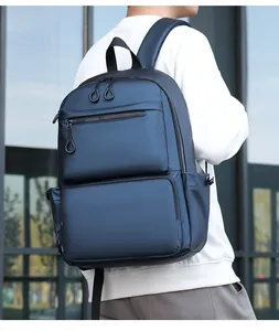 Detail showing deep blue waterproof nylon business backpack with multi-pocket design and zippers