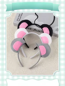 Detailed view of mouse ear headbands in black, white, and gray with plush fabric