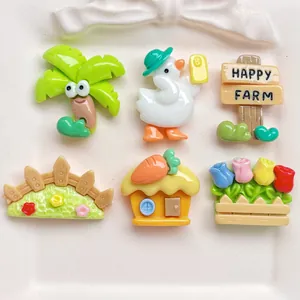 Detailed view of six resin garden flatbacks including duck, house, and happy farm sign