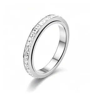 Macro shot of square-cut cubic zirconia eternity ring in polished silver finish