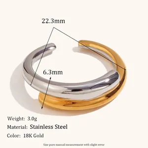 Macro detail of two-tone stainless steel ring with 18K gold plating and sizing specifications